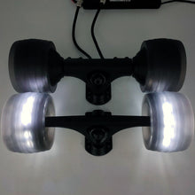Load image into Gallery viewer, Upgrade your ride with 105mm AT Glow Wheels and Sleeves for Electric Skateboard - Illuminate your path with these high-performance all-terrain wheels, equipped with vibrant glow technology. The set includes durable sleeves for a smooth and stylish ride, perfect for enhancing your electric skateboard experience.
