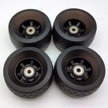 Load image into Gallery viewer, Illuminate Your Ride with 105mm AT Glow Wheels for Electric Skateboard - Experience a vibrant and stylish journey with these all-terrain wheels. The glow-in-the-dark technology adds a cool visual element while ensuring a smooth and high-performance ride for your electric skateboard adventures.
